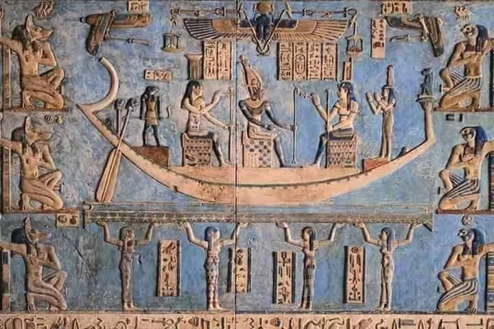 A painted blue relief of deities around a solar barque, Dendera Temple ceiling