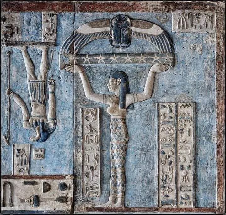 A painted relief of the sky goddess lifting a winged scarab and stars, Dendera